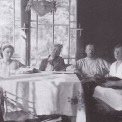 Tatiana with her parents and grandmother at a summer house