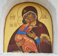 Icon of the Holy God Mother above the entrance into the church